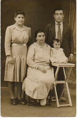 Mom as a baby...with her parents and sister